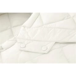 Cybex Snogga Mini 2 Seashell Beige Fußsack -Cybex Geschäft cyb 22 int deta snogga2line sebe buttons print medium 1